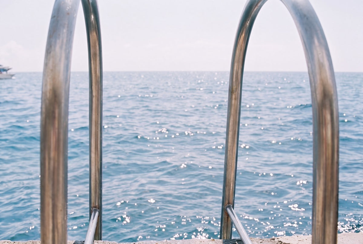 The ladder at the end of the sea wall, empty