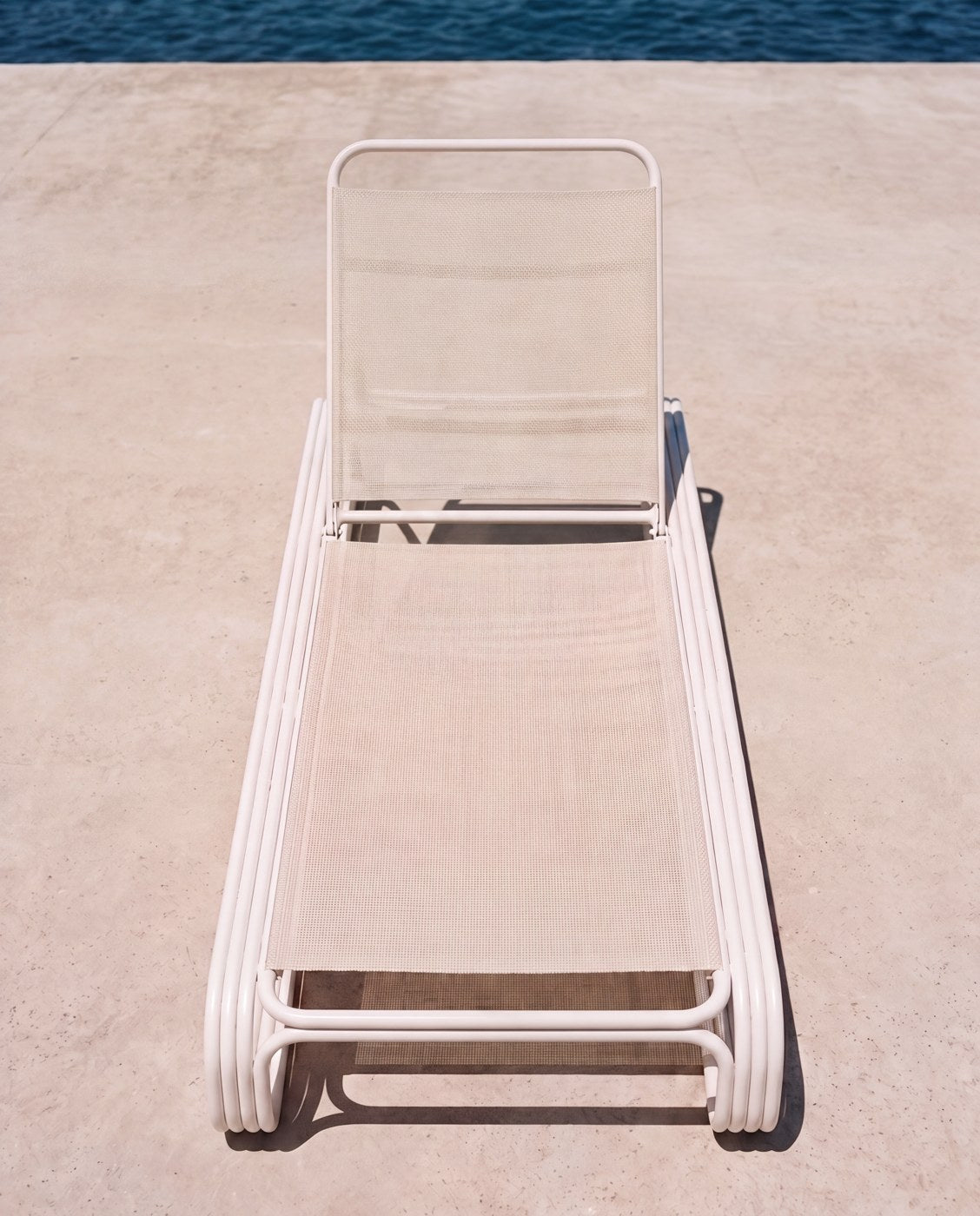 The lounger on the sea wall, empty